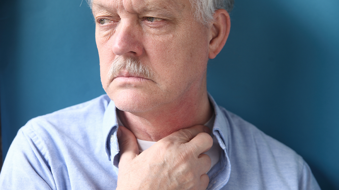 Man suffering from heartburn